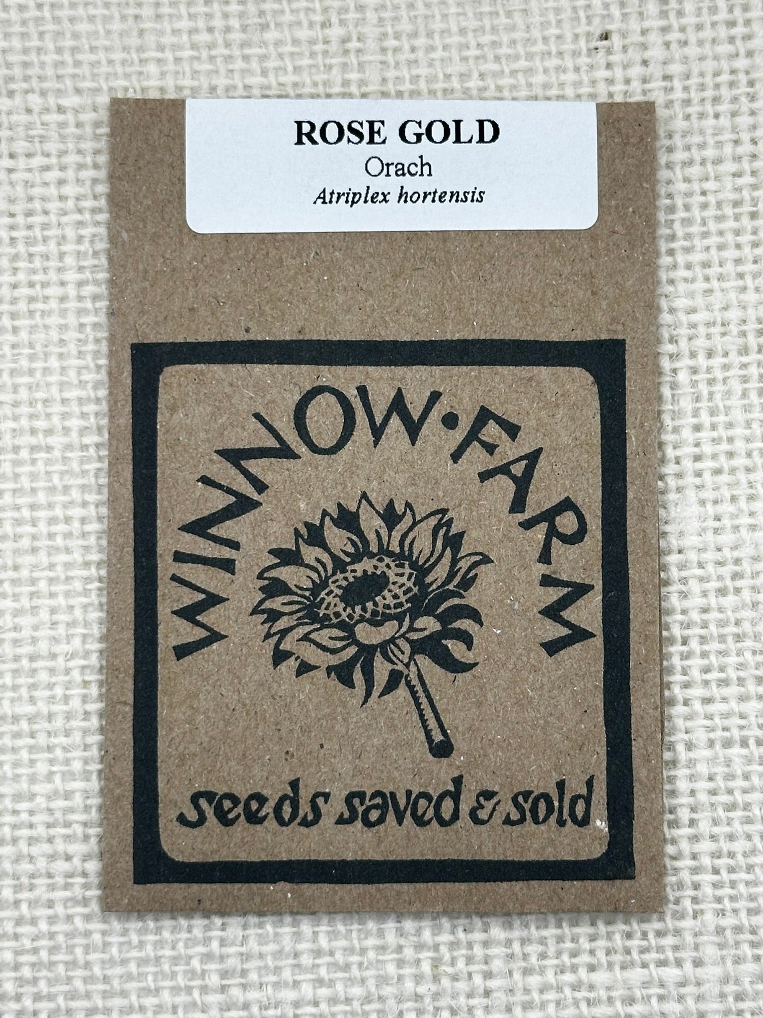 Seed packet labeled 'Rose Gold Orach' by Winnow Farm on a textured beige background