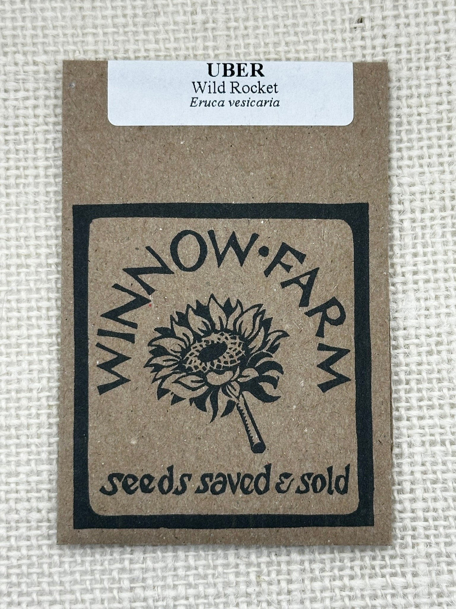 Seed packet from Winnow Farm with sunflower design on a textured background