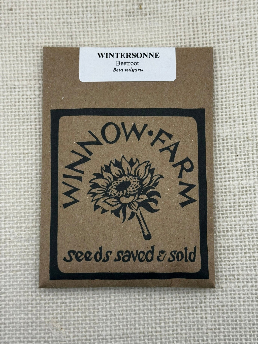 Seed packet from Winnow Farm on a textured beige background